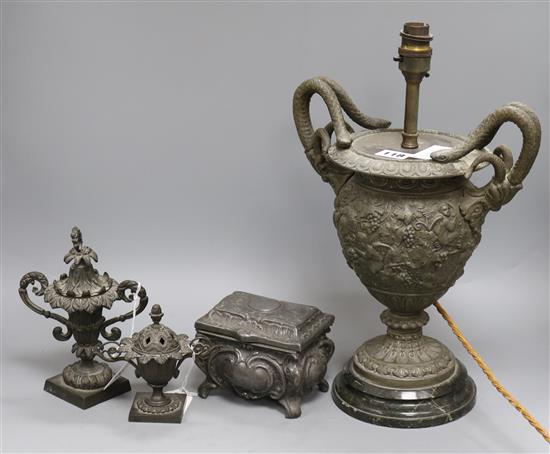 A metal two handled putti decorated table lamp, a metal box, a censer and a lamp